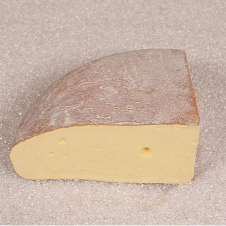 A quarter of fontina cheese