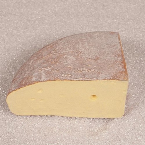 A quarter of fontina cheese